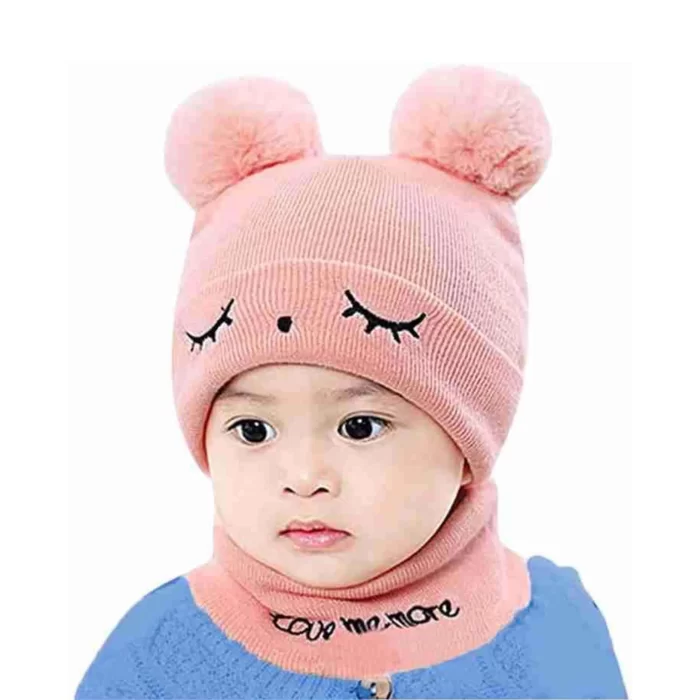 a baby wearing a pink beanie hat and scarf set perfect for winters from TENDSY