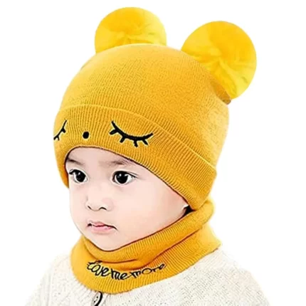 a baby wearing a yellow beanie hat and scarf set perfect for winters from TENDSY